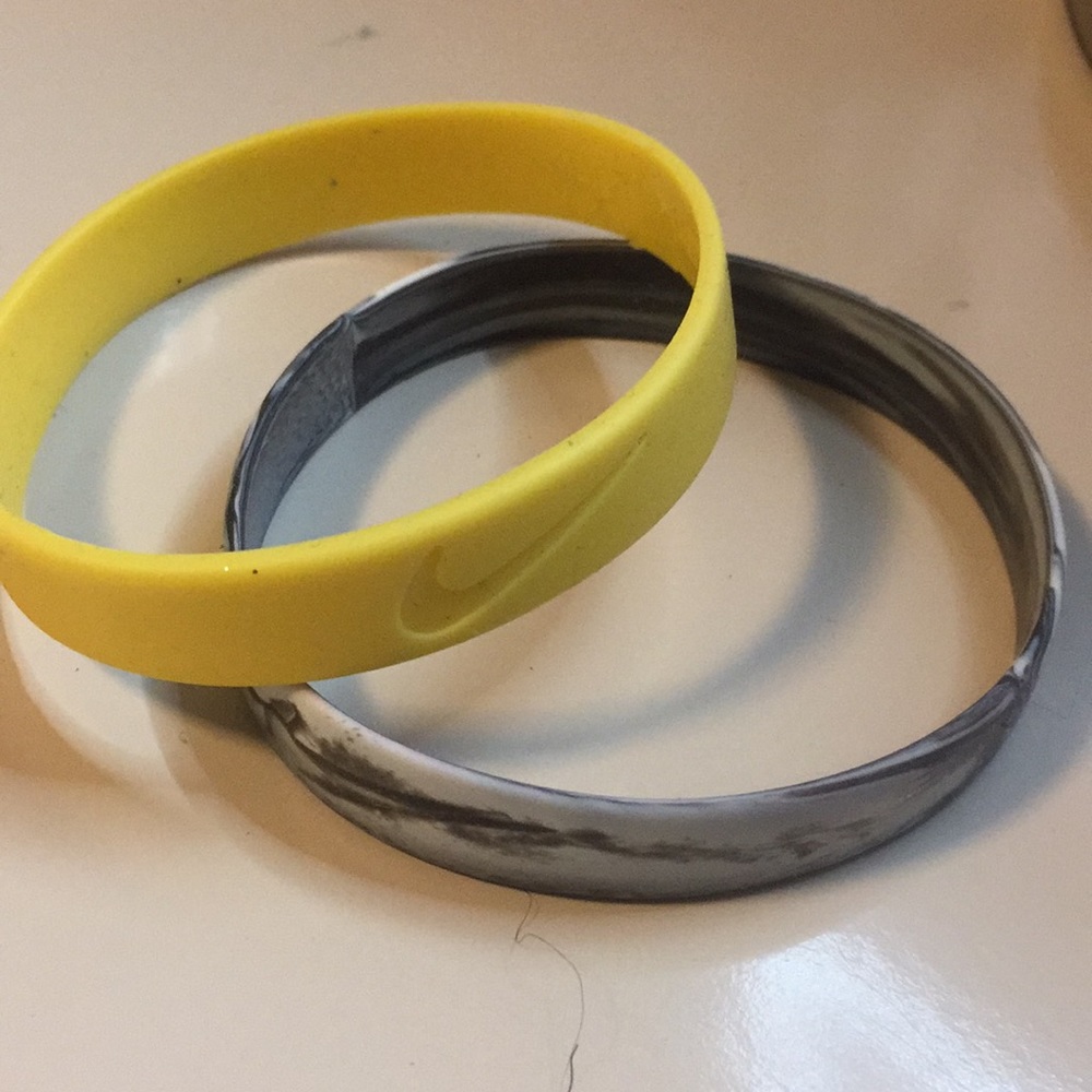 Yellow, Black and white Nike Rubber Bracelets